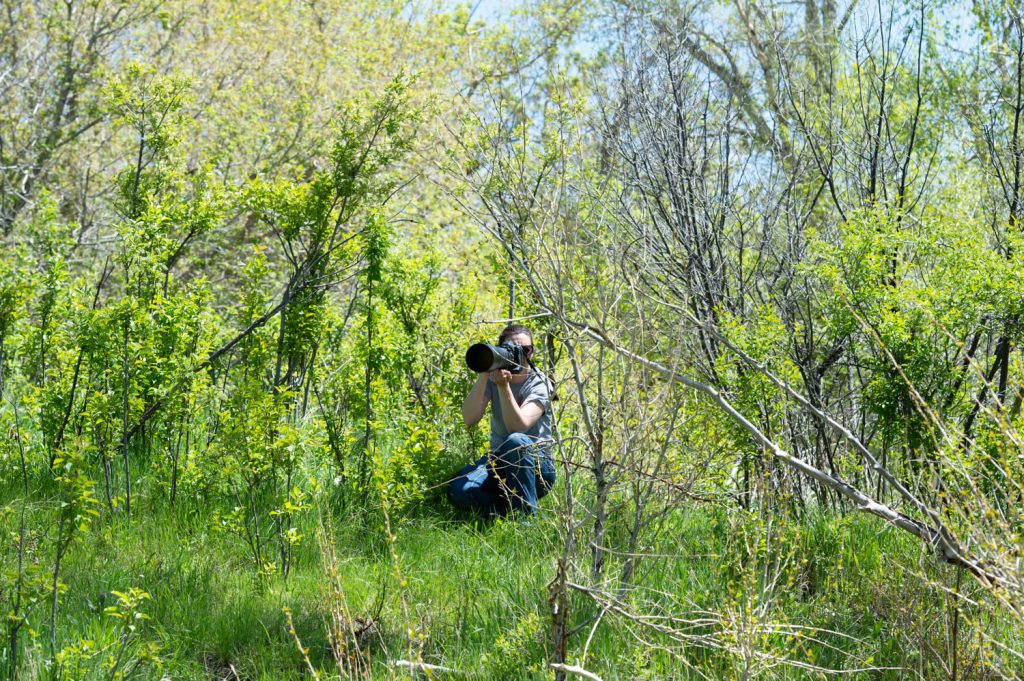 Weaver Leather Micheala taking pictures in the brush